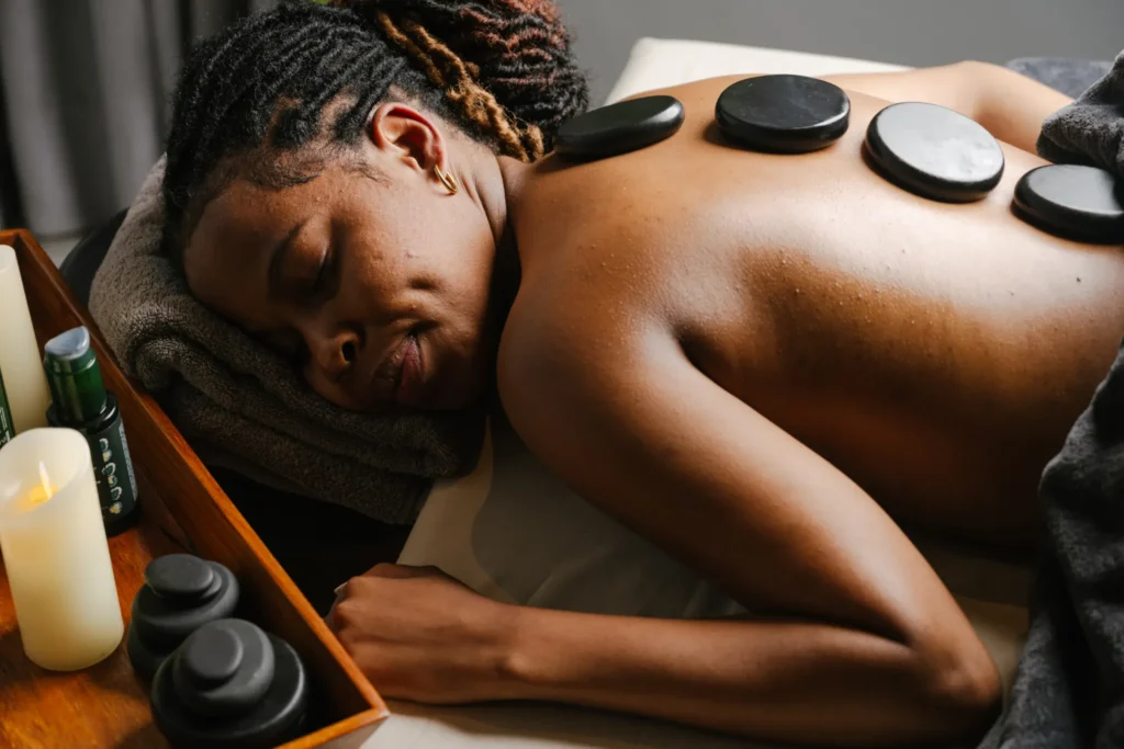 Guest with eyes closed during a hot stone massage